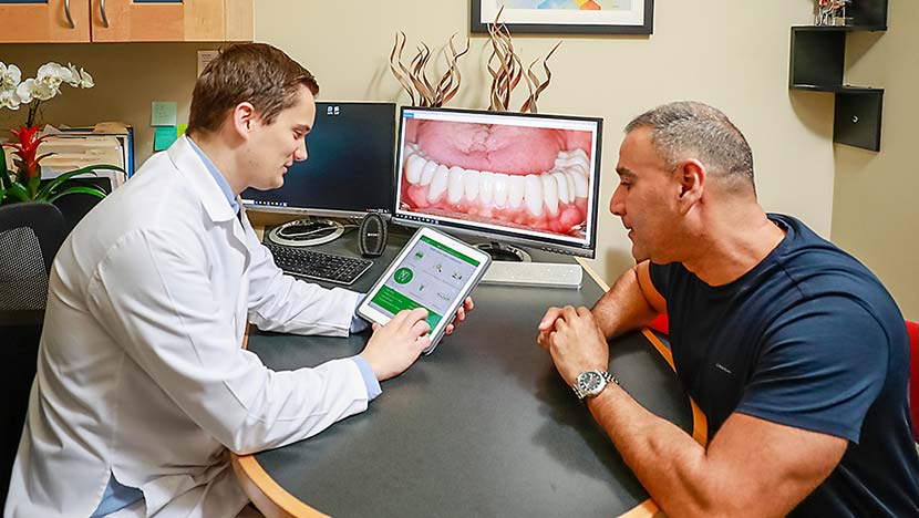 Dentist reviewing treatment options with patient
